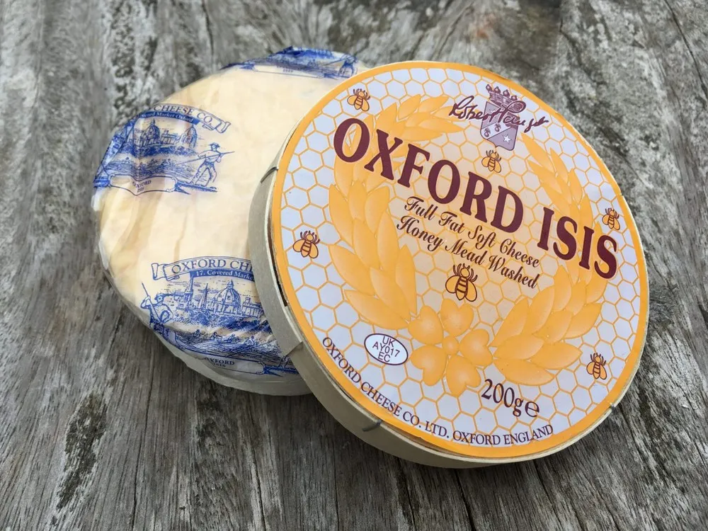 Oxford Isis cheese in a small wooden box displaying the label on top