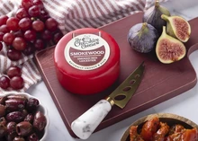 Smokewood - Smoked & Aged Red Leicester Cheese on a wooden board with fresh fruits