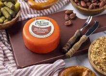 Old Hag - Ale & Mustard Cheddar Cheese on a wooden board with nuts