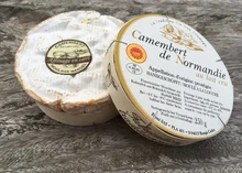 Camembert de Normandie cheese comes beautifully packaged in a round carton, featuring its name and other details on the label