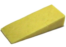 A slice of Farmhouse Mature Cheddar cheese placed against a white background.