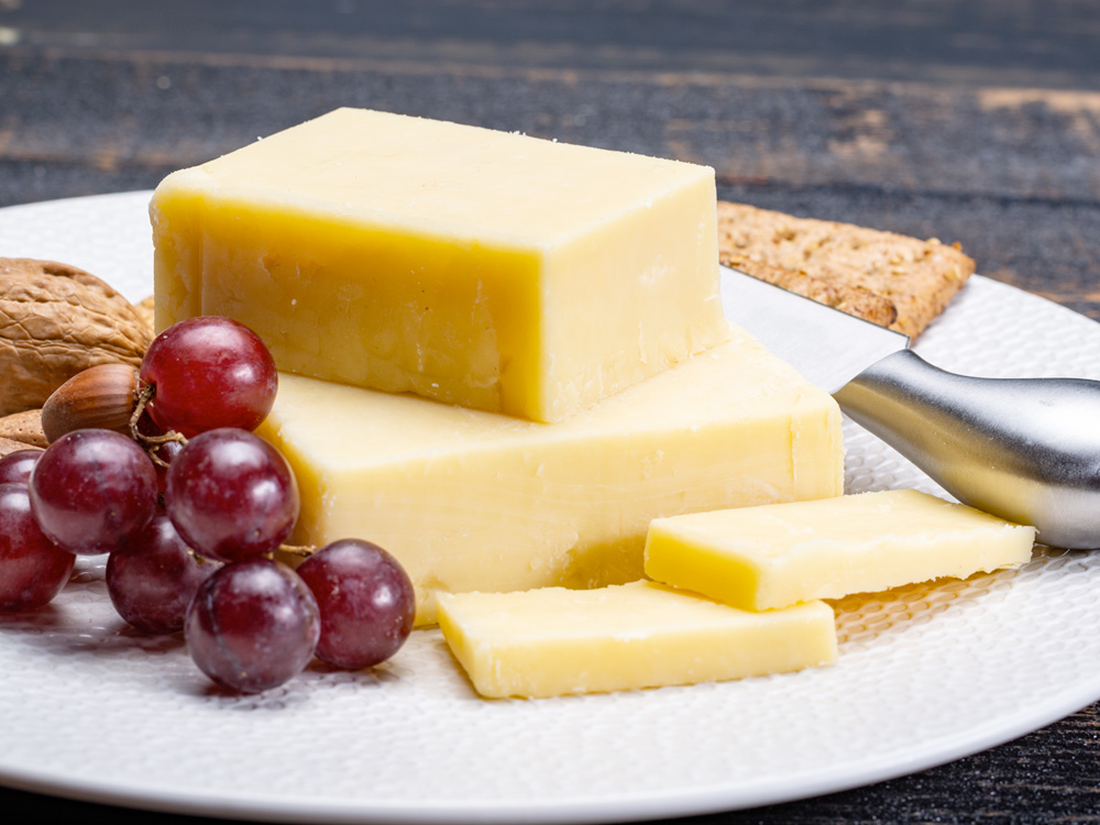 https://www.cheese.com/media/img/cheese/27-aged-british-cheddar-shutterstock_1125720782.jpg