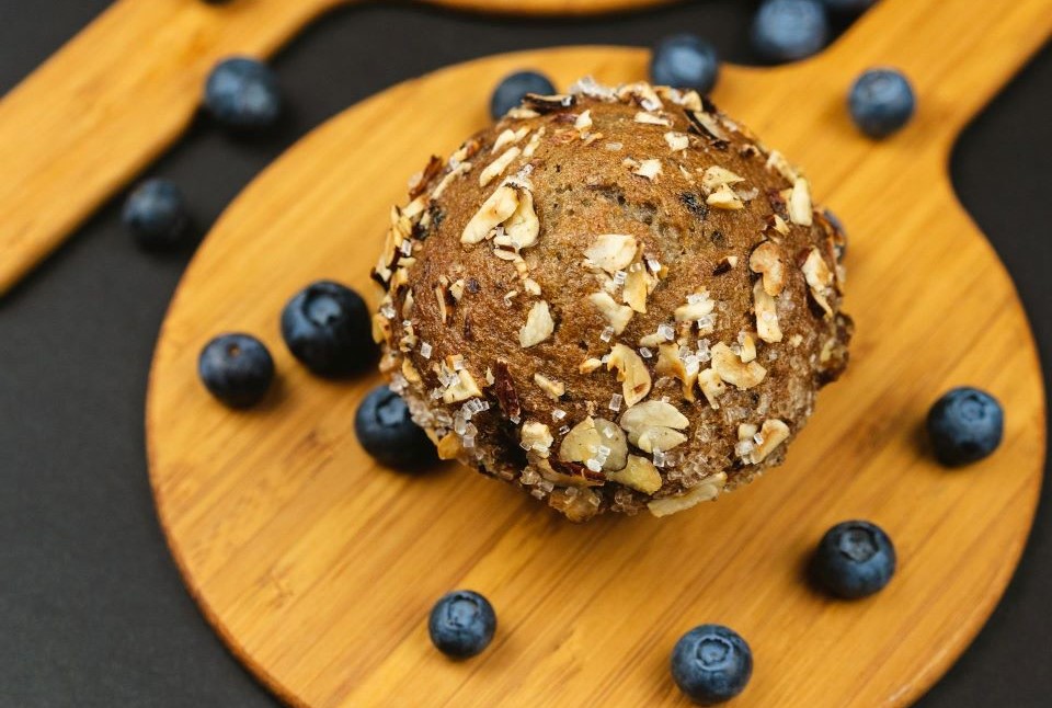 blueberry muffins and scattered blueberries