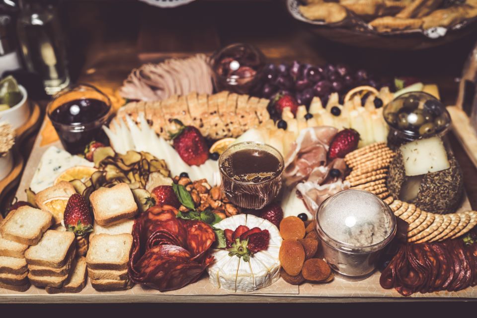 charcuterie board filled with cheese and other things